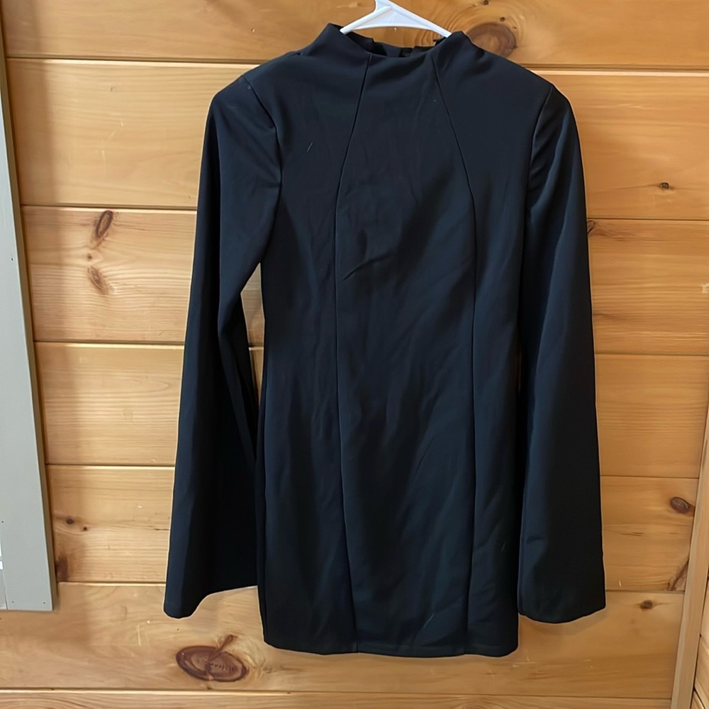 Black backless long sleeve tight fitting formal dress with padded shoulders